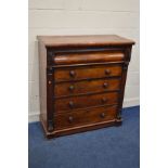 A VICTORIAN FLAME MAHOGANY SCOTTISH CHEST OF FOUR LONG DRAWER, the frieze with a secret drawer,