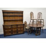 AN OAK OVAL TOPPED GATE LEG TABLE, four wheel back chairs together with Priory oak dresser with