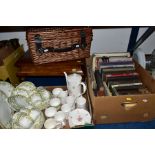 TWO BOXES OF BOOKS, TEA AND COFFEE WARES, A WICKER PICNIC HAMPER, etc including a Victorian walnut