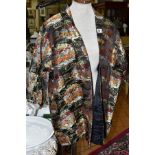 AN ORIENTAL INSPIRED EVENING JACKET, black silk lined, approximate length 78cm (underneath collar to