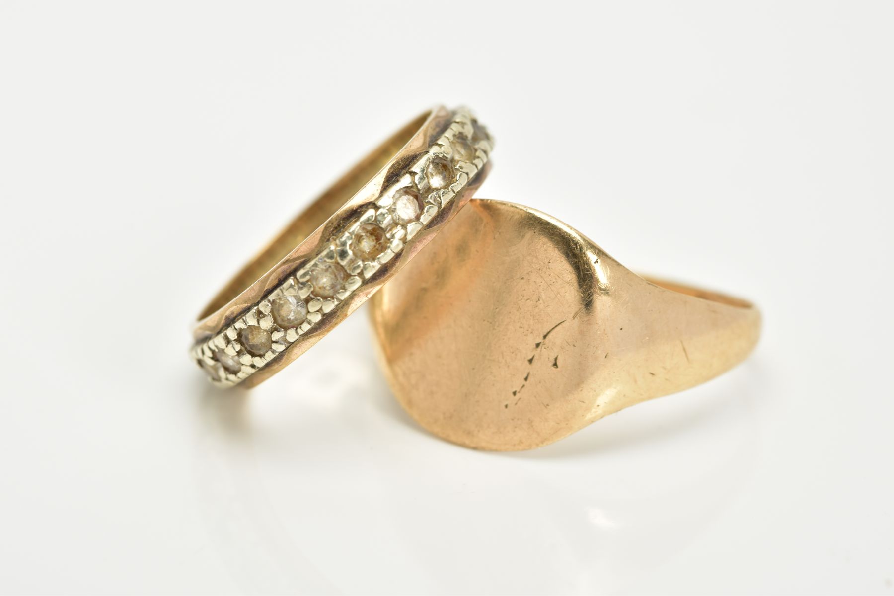 A GENTS SIGNET RING AND A FULL ETERNITY RING, the yellow metal gents signet ring, with a rubbed - Image 2 of 3