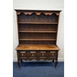 AN EARLY 20TH CENTURY AND LATER OAK DRESSER, the top with triple shelves, above a base with two deep
