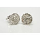 A PAIR OF WHITE METAL CLUSTER EARRINGS, each of a circular form, set with single cut diamond