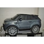 AN ELECTRIC RANGE ROVER TOY CAR 145cm long (PAT fail due to joined cable, but charges and working)