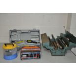 A CASED TROLLEY JACK, a metal toolbox with tools, a battery charger and a hardware caddy with