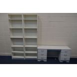 A MODERN WHITE DRESSING TABLE, with eight drawers, together with two modern white open bookcases (