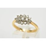 AN 18CT GOLD DIAMOND CLUSTER RING, the cluster of an oval form, set with fifteen graduated round