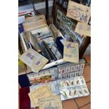 CIGARETTE CARDS, a large collection of assorted cigarette/trade cards in three albums, framed and