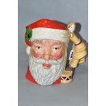A ROYAL DOULTON CHARACTER JUG, 'Santa Claus' D6668, style one, handle is doll and drum