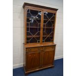 A 20TH CENTURY MAHOGANY ASTRAGAL GLAZED BOOKCASE, with two drawers above cupboard doors, width 115cm