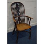 A 19TH CENTURY ELM AND YEWWOOD WINDSOR ARMCHAIR, with a pierced splat back, on turned legs united by