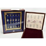 A CASED SET OF TEN SILVER 'QUEENS BEASTS' SPOONS, a wooden display case with glass screen, holds