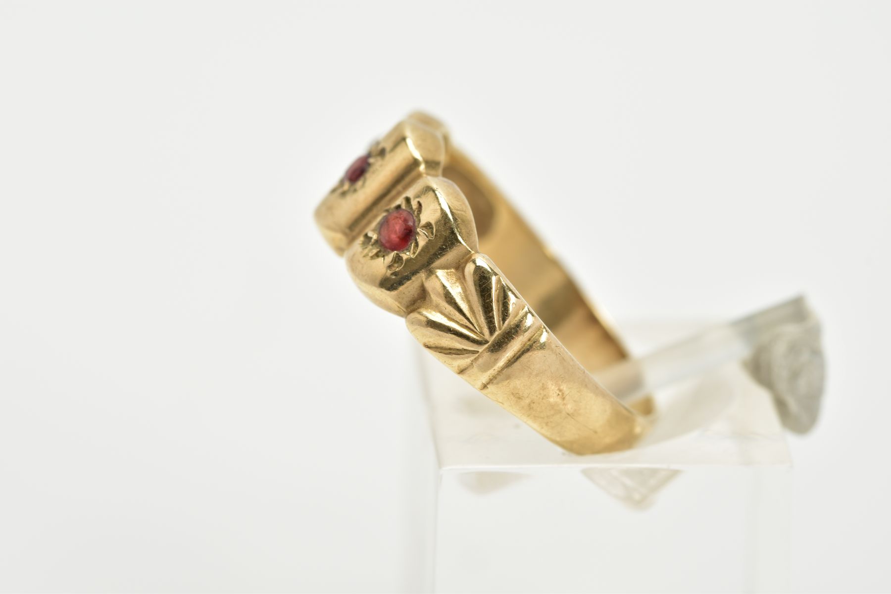 A 9CT GOLD GARNET RING, designed with three curved sections, each set with a circular cut garnet, to - Image 2 of 3