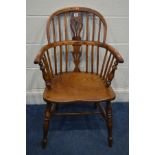 A 19TH CENTURY ELM AND YEWWOOD WINDSOR ARMCHAIR, with a pierced splat back, on turned legs united by