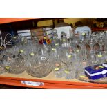 A QUANTITY OF GLASSWARE, including wine glasses, brandy balloons, tumblers, liqueur glasses,