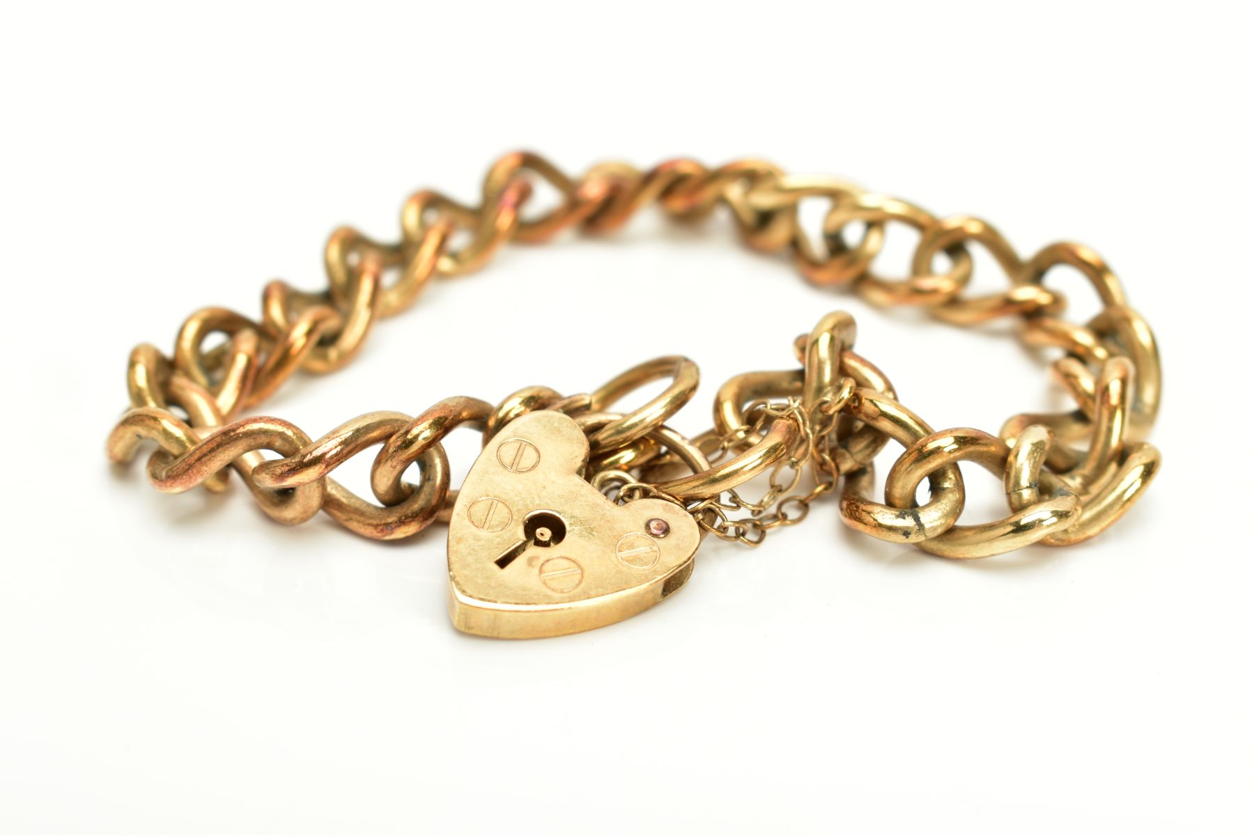 A 9CT GOLD HEAVY CHARM BRACELET, of curb link design hallmarked 9ct gold London import, fitted - Image 2 of 3