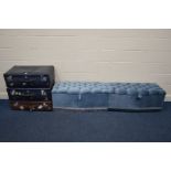 THREE VINTAGE SUITCASES, together with two blue upholstered ottomans (5)