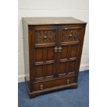 A REPRODUCTION OAK PANELLED TWO DOOR CABINET, width 86cm x depth 47cm x height 118cm (no backboard)