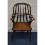 A 19TH CENTURY ELM AND OAK WINDSOR ARMCHAIR, on turned legs united by a H stretcher