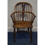 A 19TH CENTURY ELM AND OAK WINDSOR ARMCHAIR with a pieced splat back, on turned legs united by a
