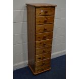 A TALL SLIM MODERN PINE CHEST OF NINE DRAWERS, width 43cm x depth 39cm x height 141cm