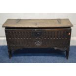 AN OAK SIX PLANK CHEST/COFFER, possibly from the 17th century, iron hinges, carved front with