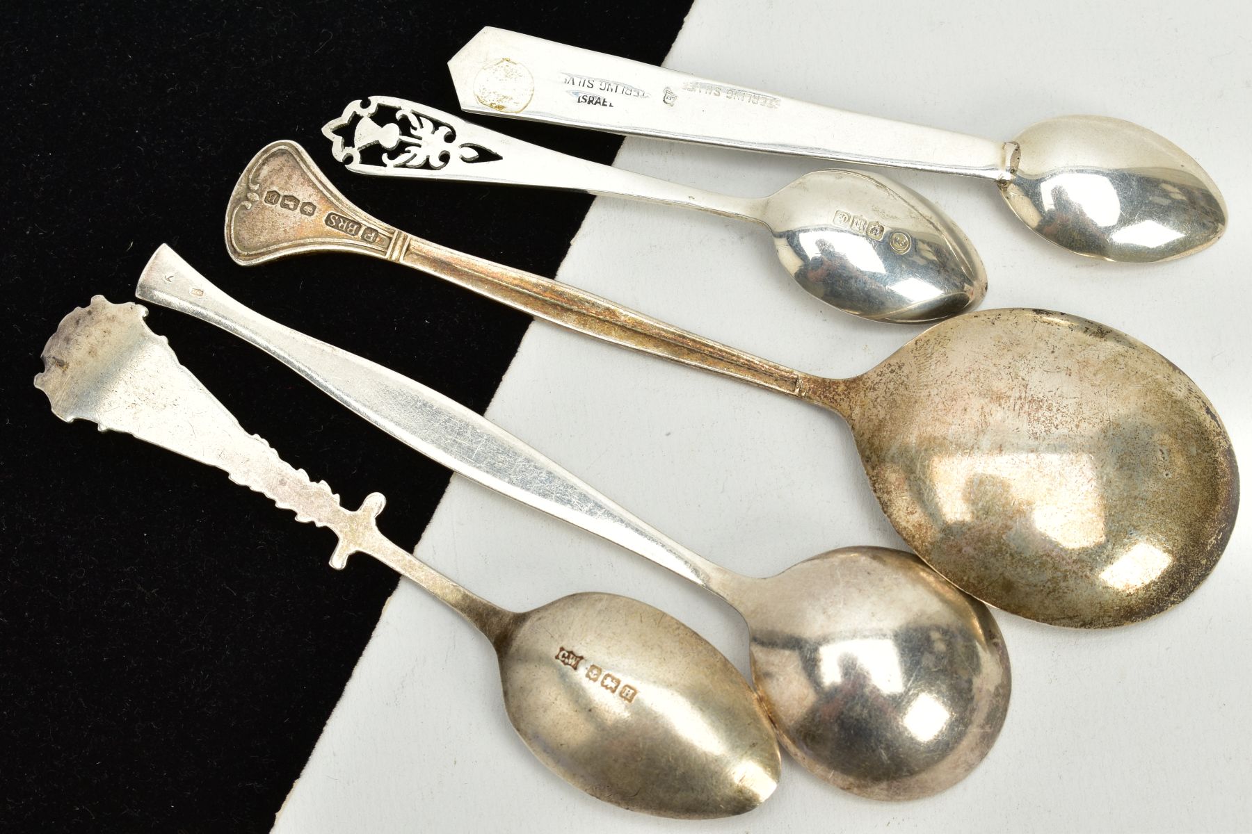 A SMALL PARCEL OF SILVER/WHITE METAL SPOONS, to include a foliate engraved soup spoon, hallmarked - Image 2 of 2