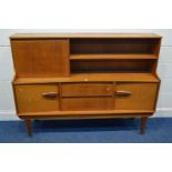 A 1960'S/70'S TEAK HIGHBOARD, the top with a white formica fall front, above a base with two