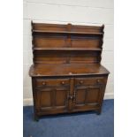 A DARK ERCOL DRESSER with two drawers, width 124cm x depth 46cm x height 151cm