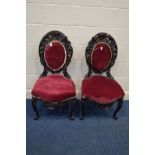 A PAIR OF 20TH CENTURY ELBORATELY CARVED OVAL BACK CHAIRS (sd)
