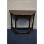 AN EARLY TO MID 20TH CENTURY HALL TABLE, canted sides, carved frieze with a single drawer, on turned