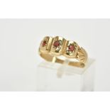 A 9CT GOLD GARNET RING, designed with three curved sections, each set with a circular cut garnet, to