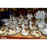 A COLLECTION OF ROYAL ALBERT OLD COUNTRY ROSES, including a tea pot, cream jug, five tea cups, seven