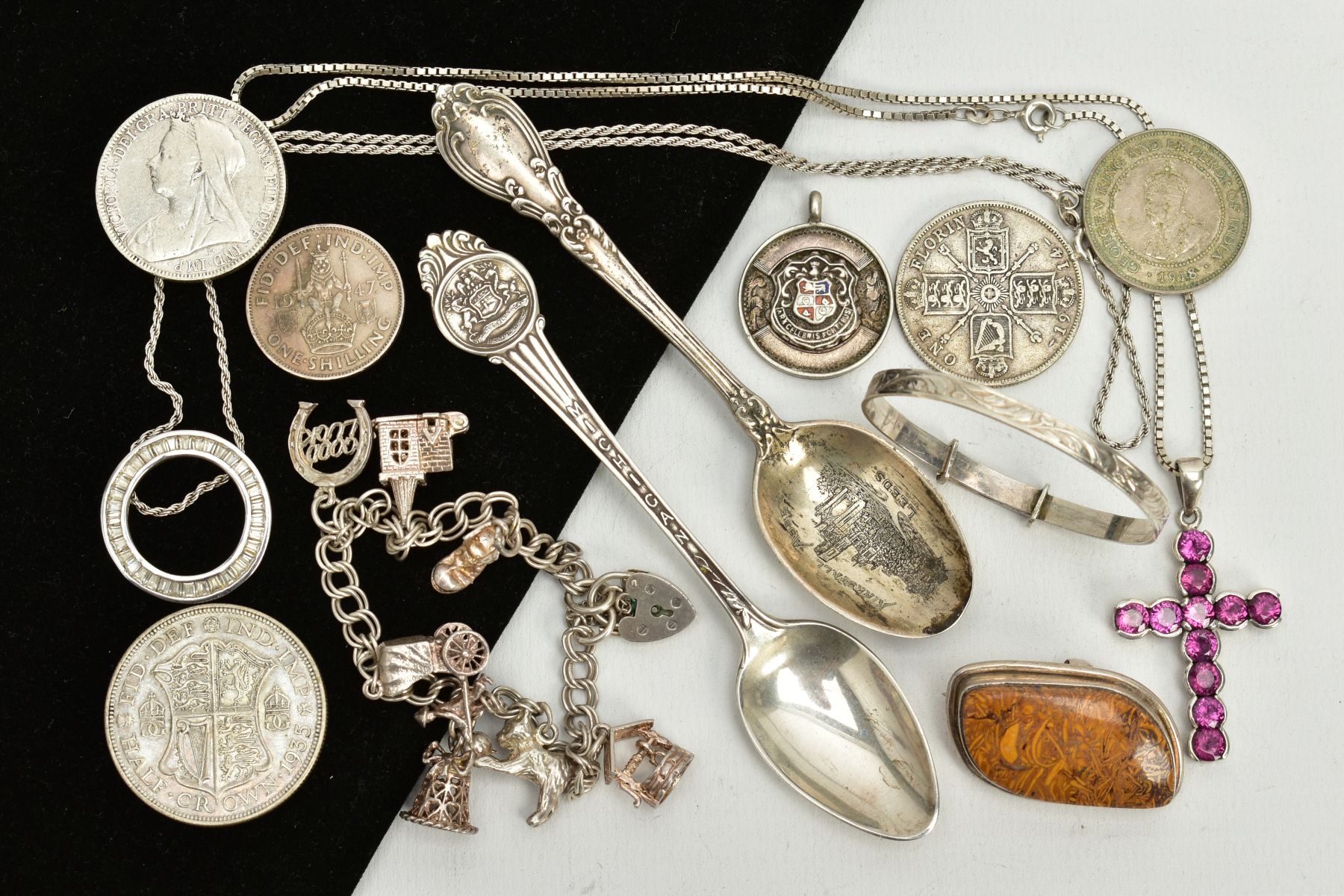 A SELECTION OF ITEMS, to include a silver teaspoon, with an engraved picture of Kirkstall abbey,