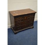 A GEORGIAN AND LATER MAHOGANY CHEST OF FOUR SHORT DRAWERS, small central cupboard door, all above