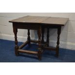 A GEORGIAN OAK PLANK TOP SINGLE DROP LEAF TABLE, on turned legs united by stretchers, open width