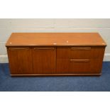 A MID 20TH CENTURY TEAK SIDEBOARD, with double cupboard doors beside two drawer, width 135cm x depth