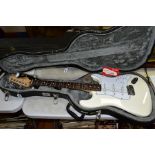 A 2008 MEXICAN FENDER STRATOCASTER Ser No MZ 8019434 in white with white scratch plate, pickup