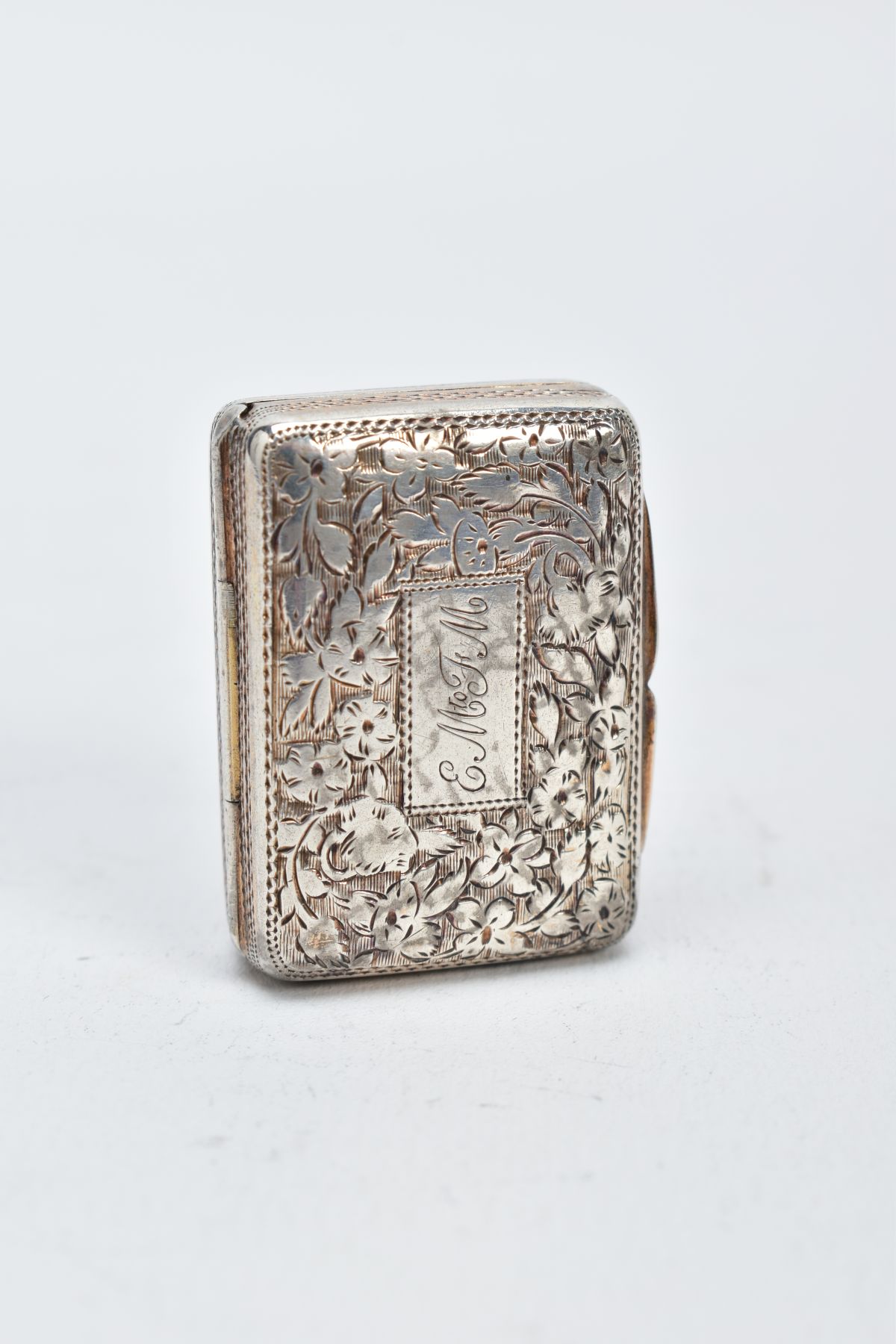 A GEORGE IV SILVER VINIGRETTE, floral engraved design, with an engraved monogram to the lid, gilt