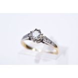 A SINGLE STONE DIAMOND RING, the yellow metal ring set with a round brilliant cut diamond, to the