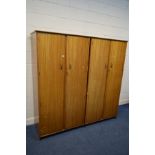 TWO AUSTIIN SUITE TEAK DOUBLE DOOR WARDROBES, with a fitted interior, width 95cm x depth 56cm x