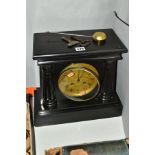 A LATE VICTORIAN BLACK SLATE MANTEL CLOCK, the moulded pediment supported on two half columns with