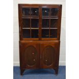 AN EDWARDIAN MAHOGANY GLAZED FOUR DOOR FLOOR STANDING CORNER CUPBOARD width 104cm x depth 53cm x