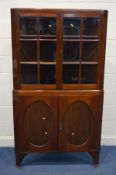 AN EDWARDIAN MAHOGANY GLAZED FOUR DOOR FLOOR STANDING CORNER CUPBOARD width 104cm x depth 53cm x