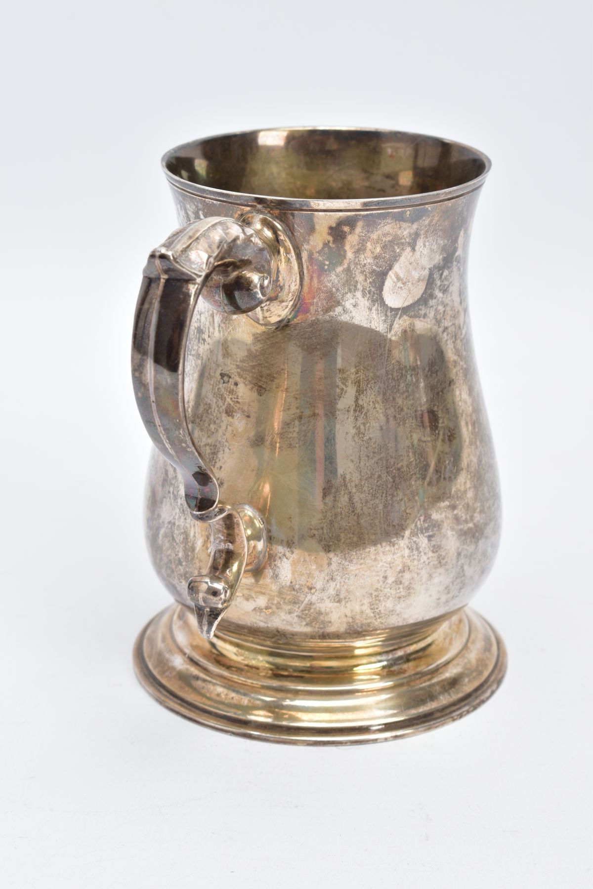 A SILVER TANKARD, of a plain polished design, bell shaped body on a circular base with a foliate - Image 3 of 6