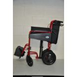 A DAYS ESCAPE FOLDING WHEEL CHAIR in red with two footrests