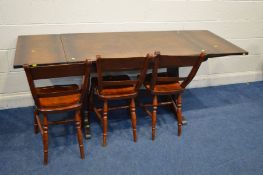 A MID 20TH CENTURY OAK DRAW LEAF DINING TABLE and three stained beech chairs (4)