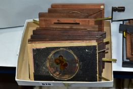 ELEVEN MAGIC LANTERN SLIDES, to include six lever slides, four slipping slides and a chromotrope