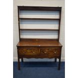 AN 18TH CENTURY OAK DRESSER the shelved top above two deep freize drawers including one silver