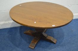 A JAYCEE OAK CIRCULAR OAK COFFEE TABLE on an acorn support diameter 96cm x height 58cm